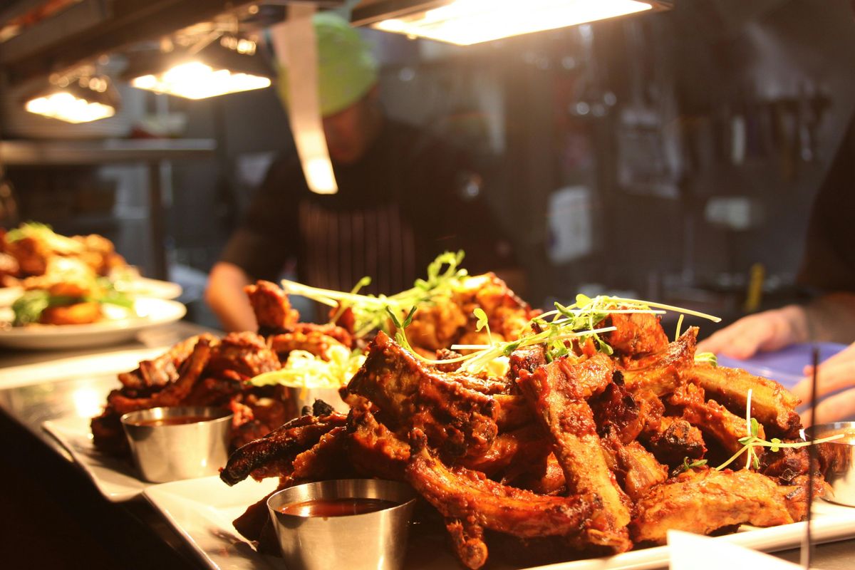 Ribs and devilled wings under the heat lamps